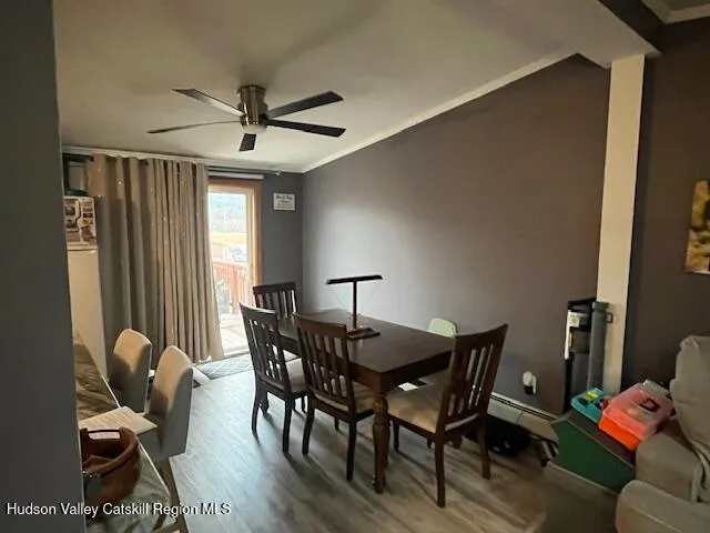 a dining room with furniture and window