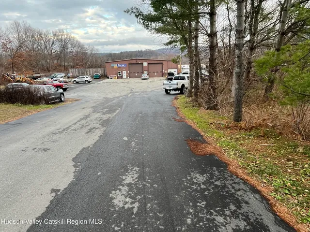 a view of a street with cars