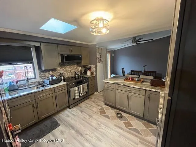 a kitchen with a sink cabinets and window