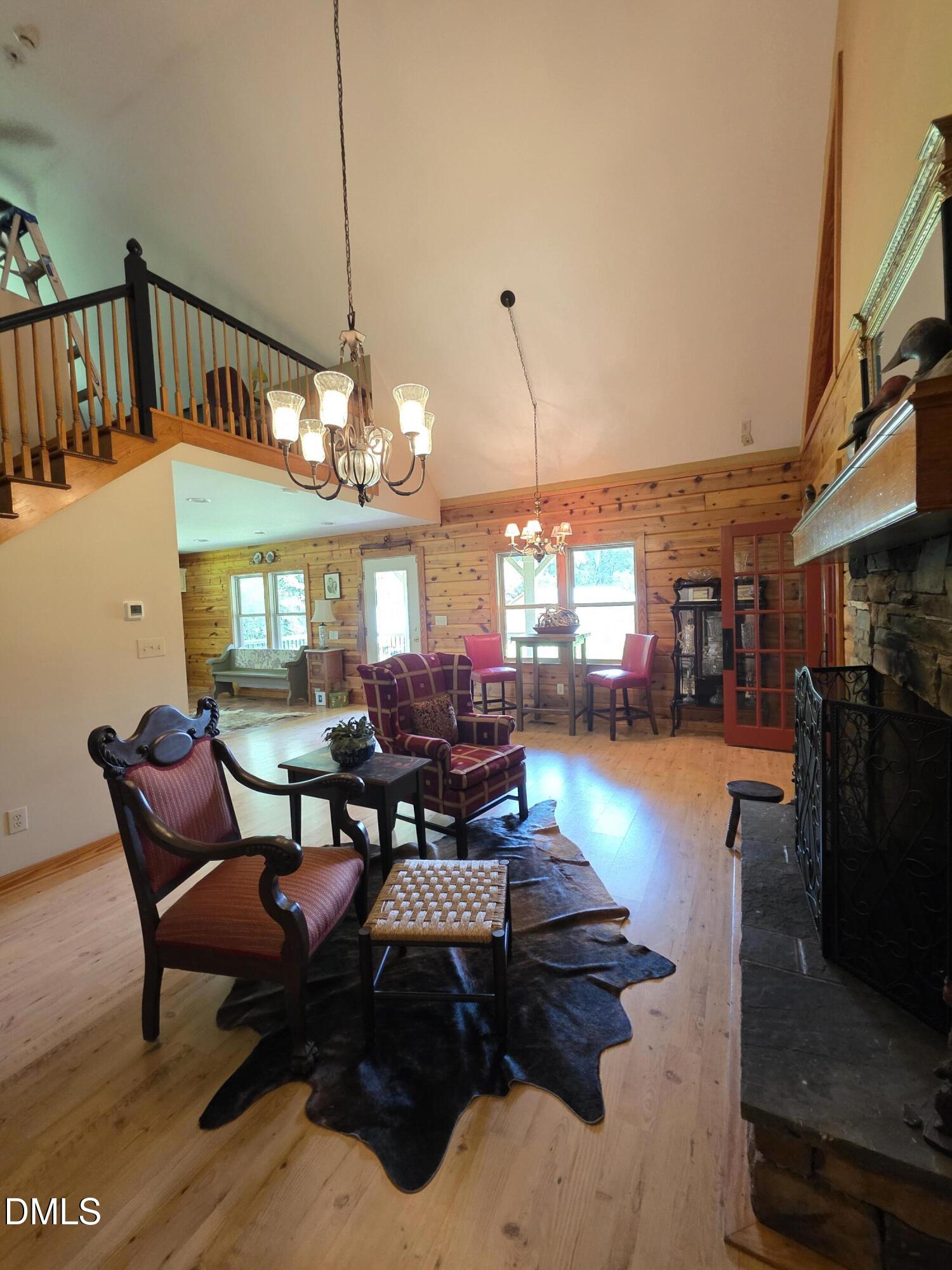 413 Johnson Town Road Zebulon, NC 27597 - Photo 23 of 42 a dining room with furniture and a chandelier