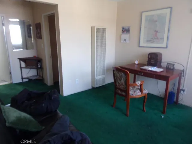 a workspace with furniture and a gate