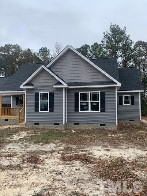 1359 Cobb Road Benson, NC 27504 - Photo 4 of 10 a view of a house with a yard