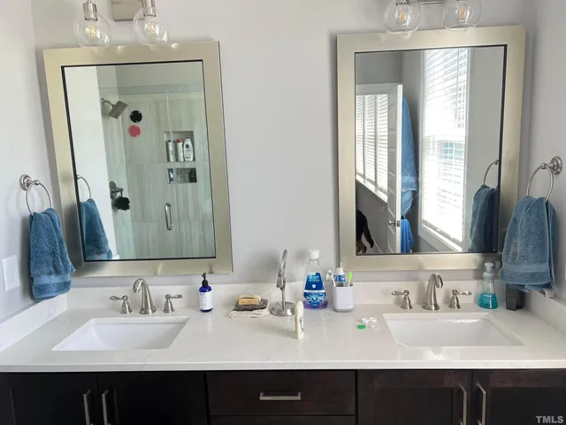 a bathroom with a sink and a mirror