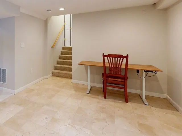 a view of a yard with plants and trees