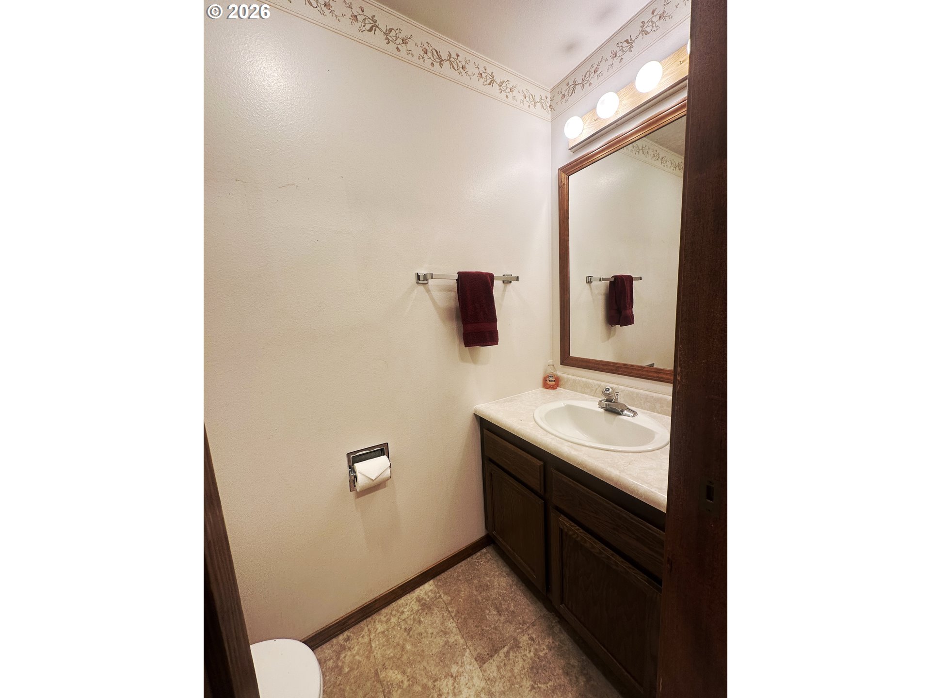 10710 South McAlister Road Island City, OR 97850 - Photo 11 of 22 a bathroom with a sink a toilet and mirror