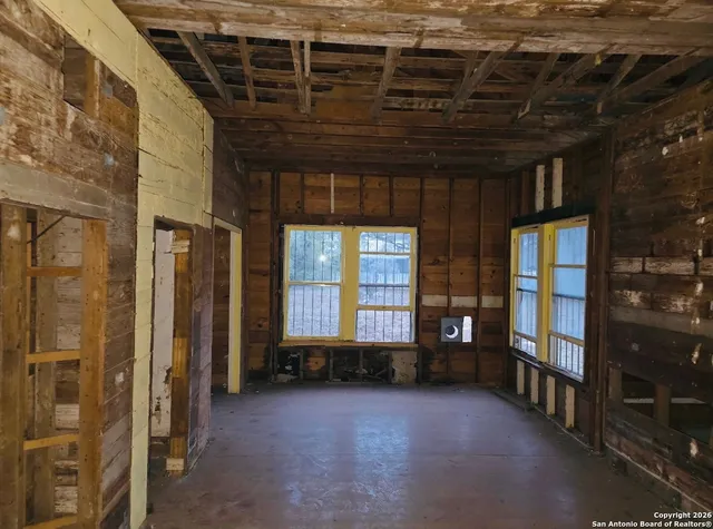 a view of an empty room with a window
