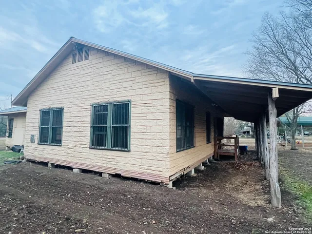 a backyard of a house with seating space