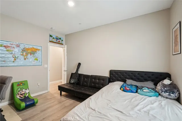 a bedroom with bed and a couch