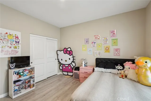 a bedroom with toys and a couch