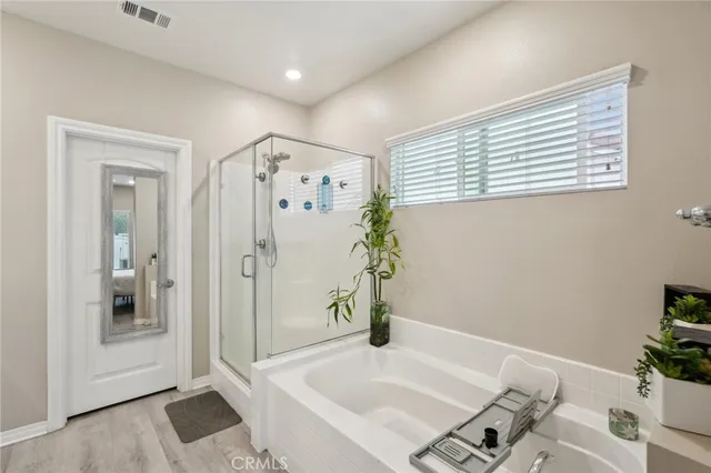 a bathroom with a tub and a shower