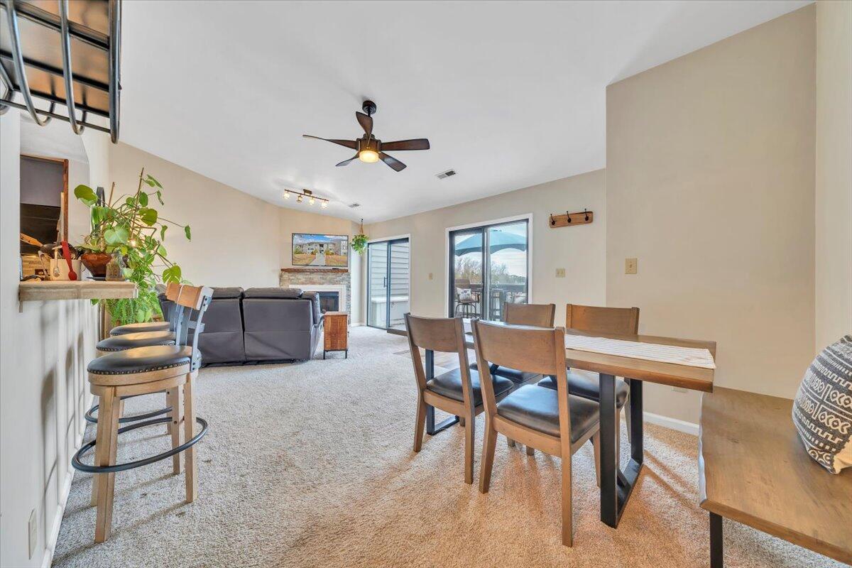 93 Peninsula Point Drive, Unit B5 Moneta, VA 24121 - Photo 16 of 48 a view of a livingroom and a dining room with furniture window and wooden floor