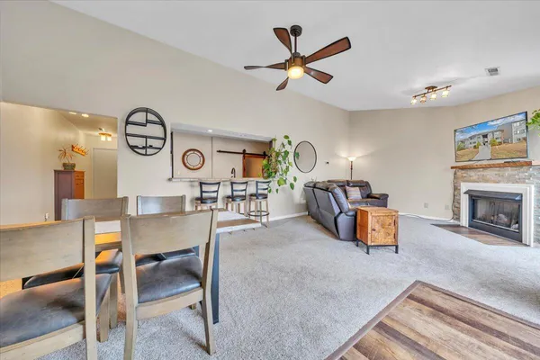 a living room with furniture fireplace and flower pot