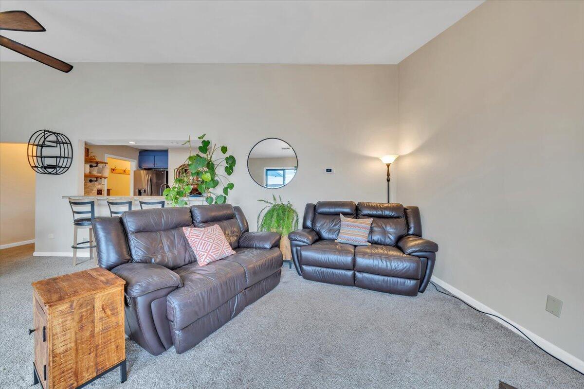 93 Peninsula Point Drive, Unit B5 Moneta, VA 24121 - Photo 20 of 48 a living room with furniture and a large window