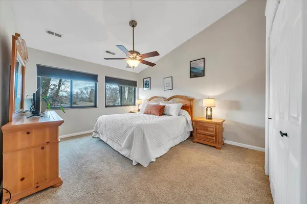 a bedroom with bed and window