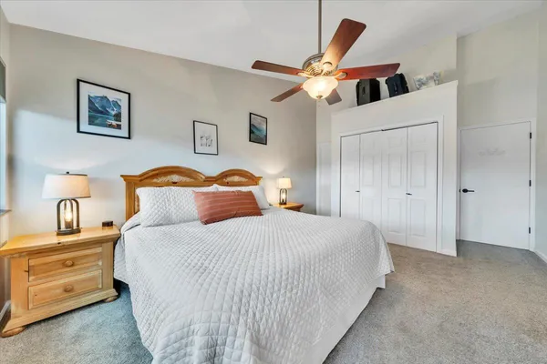 a bathroom with a sink a toilet and shower curtain