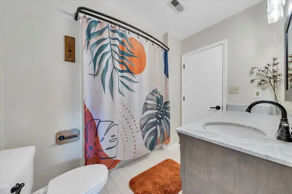 a bathroom with a sink and mirror