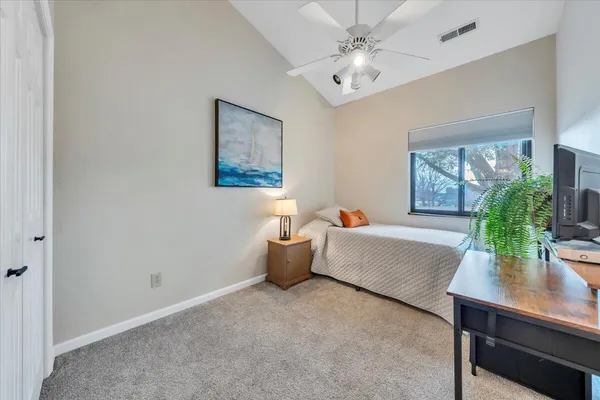 a bedroom with furniture and a window