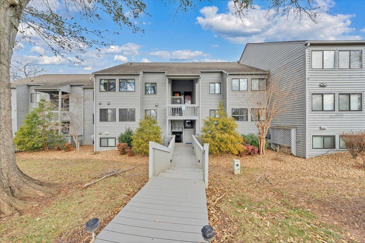 93 Peninsula Point Drive, Unit B5 Moneta, VA 24121 - Photo 38 of 48 a view of a house with many windows