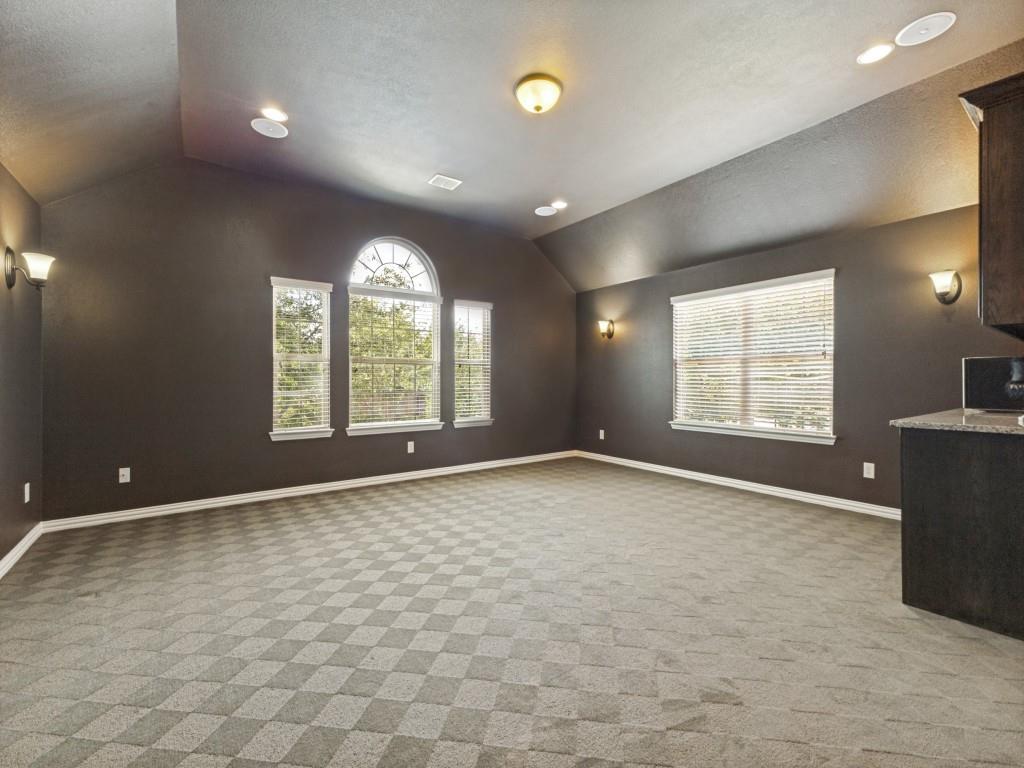 916 Redbird Lane Allen, TX 75013 - Photo 21 of 28 There are endless uses for this large bonus space with cabinetry and closet. It is located above the garage so it is positioned perfectly to be used as a media room.