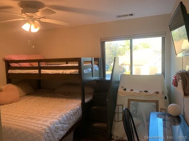 a bathroom with a sink mirror vanity and toilet