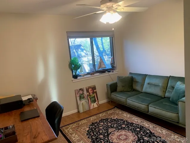 a bathroom with a toilet a sink and a mirror