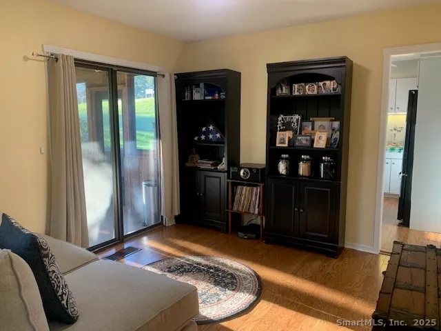 a bed room with a bed and a television