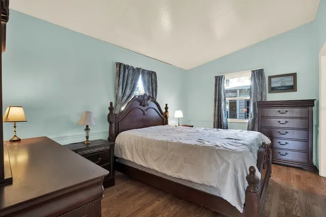 a bedroom with bed and window