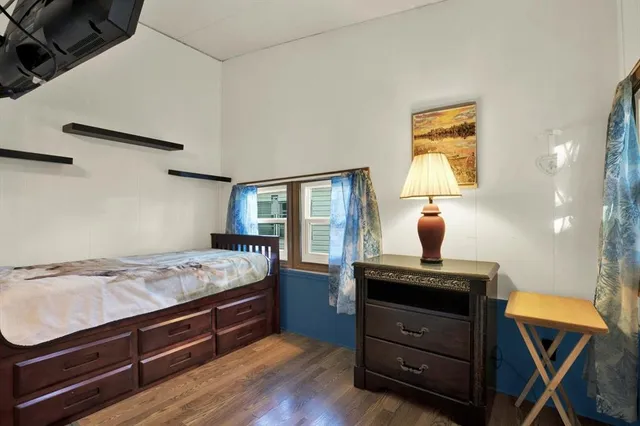 a bed room with a bed and a window