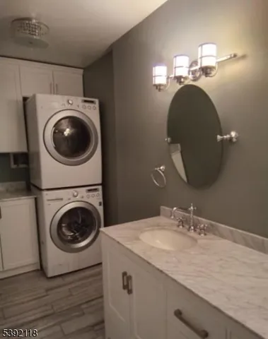 a utility room with sink dryer and washer