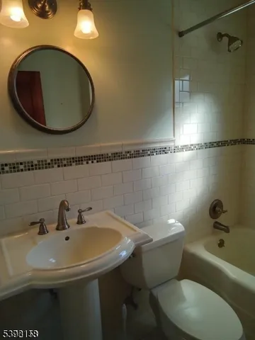 a bathroom with a sink and mirror