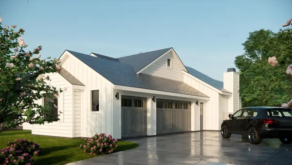 a front view of a house with a garden