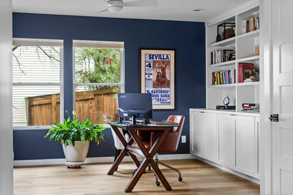 a workspace with furniture and a potted plant