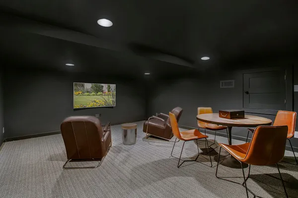a view of a workspace with furniture and wooden floor