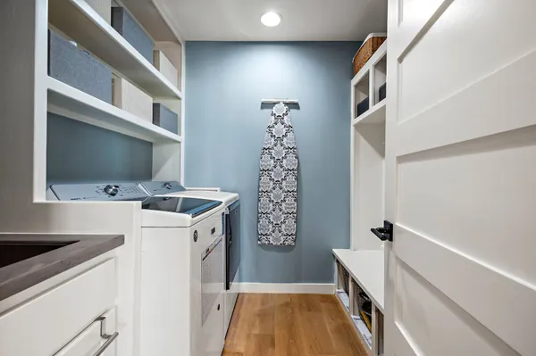 a view of bathroom with a sink and mirror