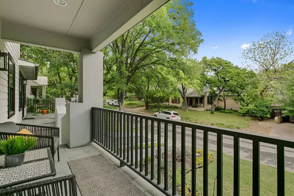 a view of a balcony with chairs