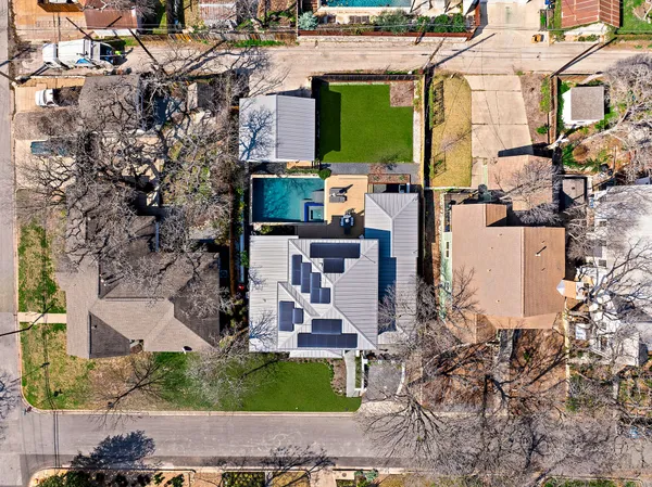 an aerial view of a house with a garden