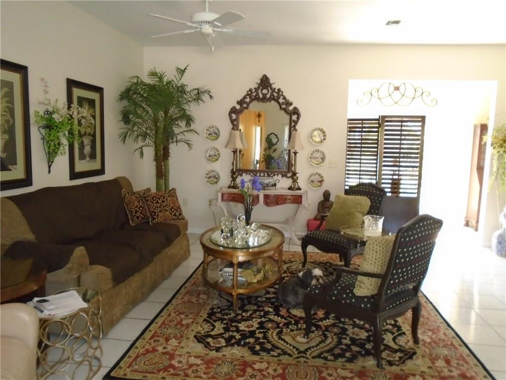2185 Southeast Harding Street Port St. Lucie, FL 34952 - Photo 15 of 34 a living room with furniture and a large window