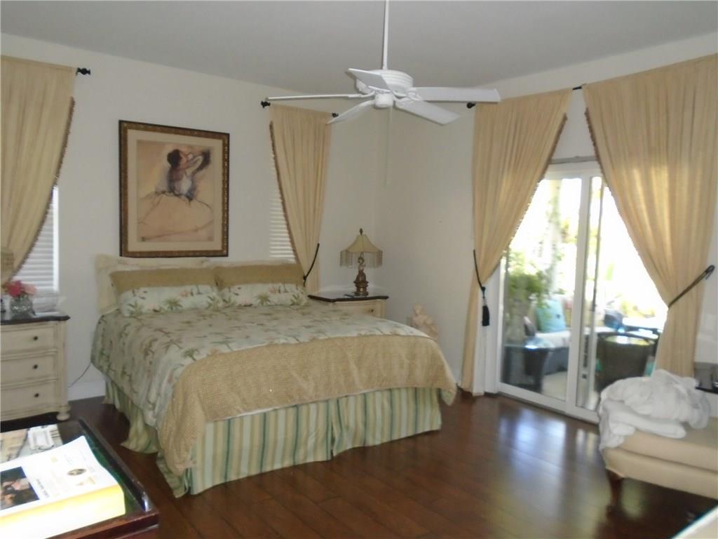 2185 Southeast Harding Street Port St. Lucie, FL 34952 - Photo 25 of 34 a bedroom with a bed and a window