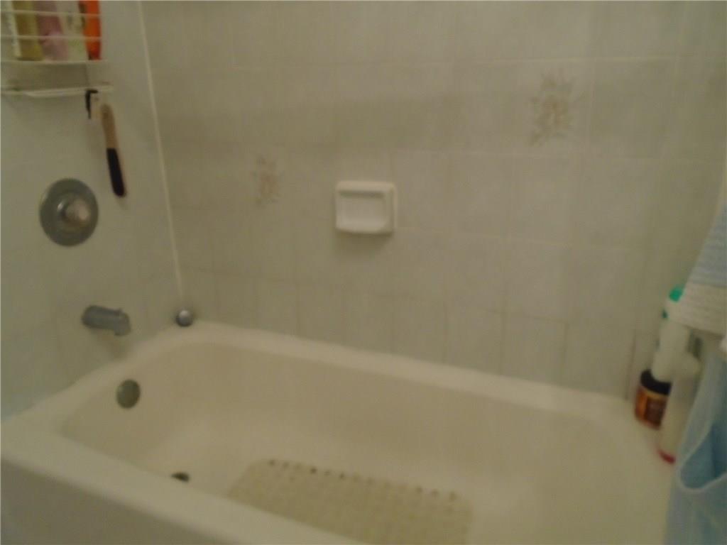 2185 Southeast Harding Street Port St. Lucie, FL 34952 - Photo 26 of 34 a bathroom with a shower