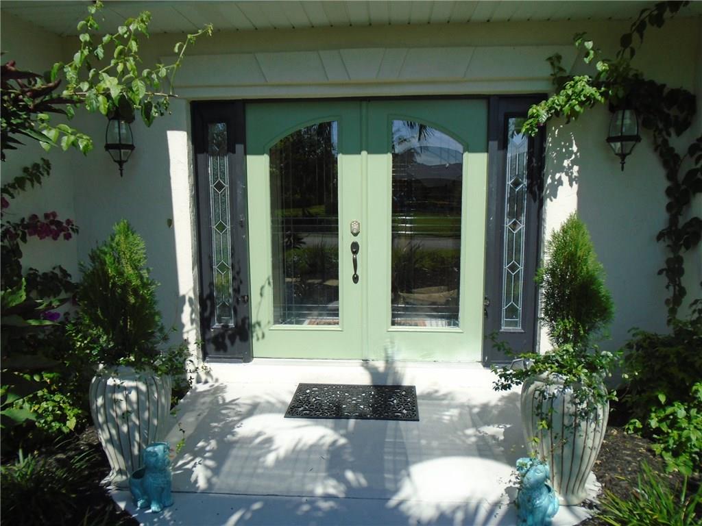 2185 Southeast Harding Street Port St. Lucie, FL 34952 - Photo 29 of 34 a view of a entryway door front of house