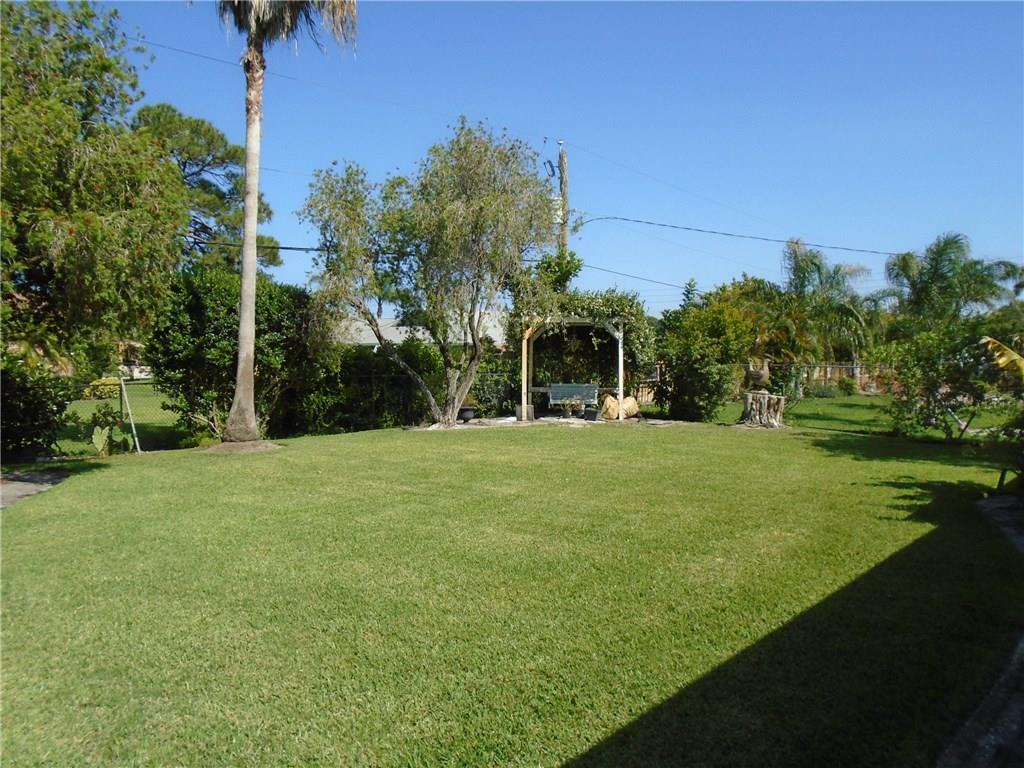 2185 Southeast Harding Street Port St. Lucie, FL 34952 - Photo 4 of 34 a view of a park with large trees