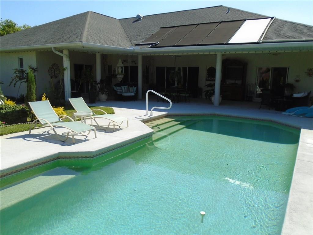 2185 Southeast Harding Street Port St. Lucie, FL 34952 - Photo 6 of 34 a view of a house with backyard porch and sitting area