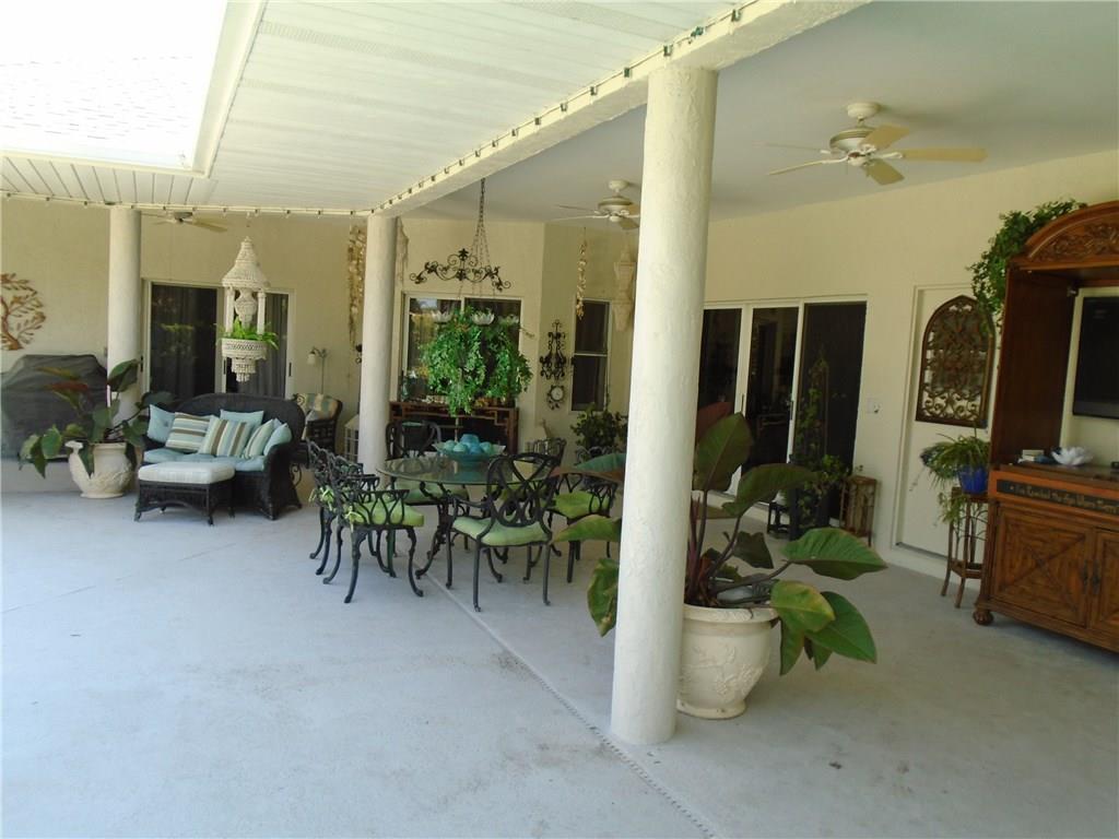 2185 Southeast Harding Street Port St. Lucie, FL 34952 - Photo 9 of 34 a room with furniture and gym equipment