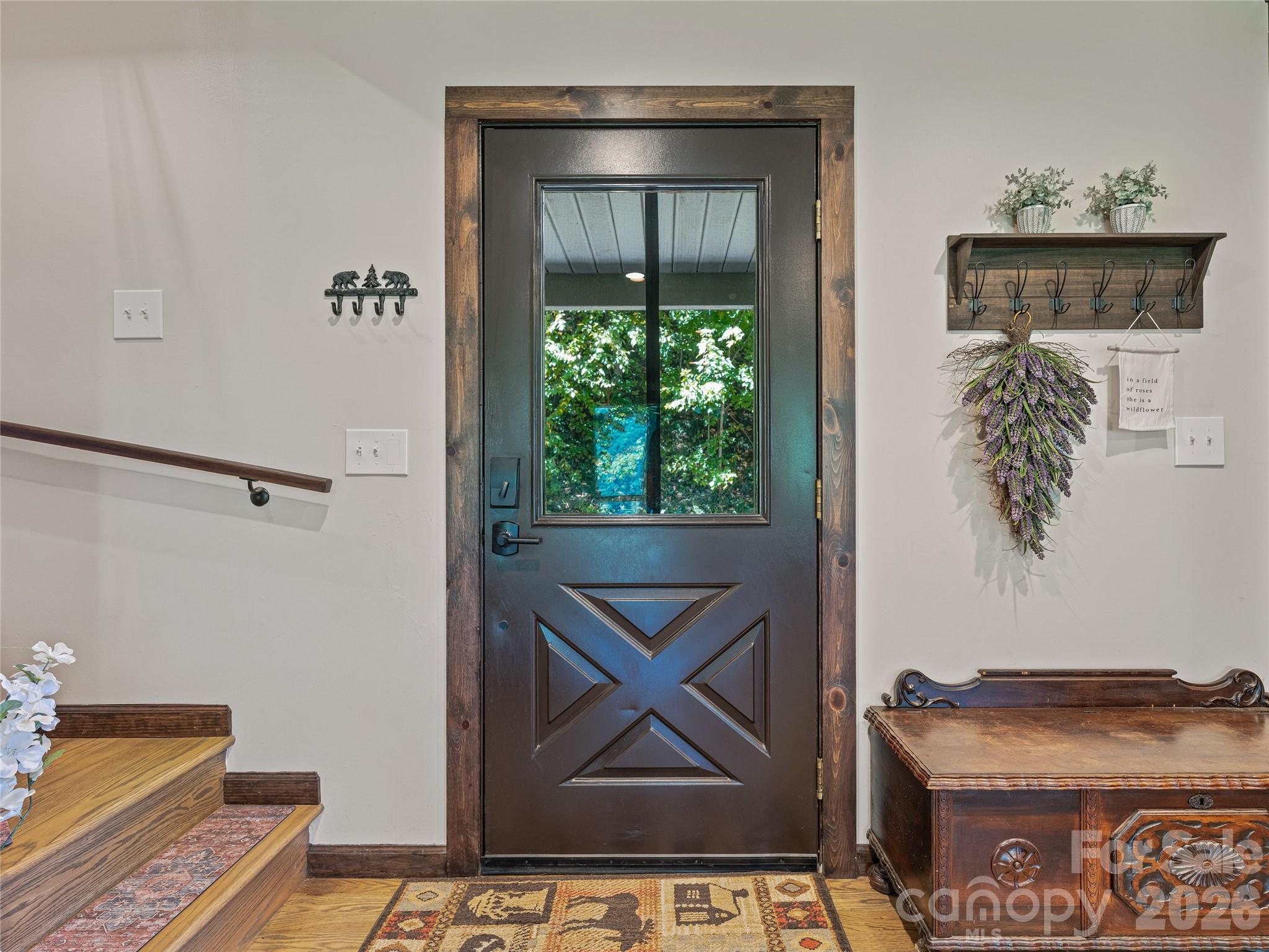 382 Black Oak Cove Road Candler, NC 28715 - Photo 7 of 46 a view of an entryway with wooden floor