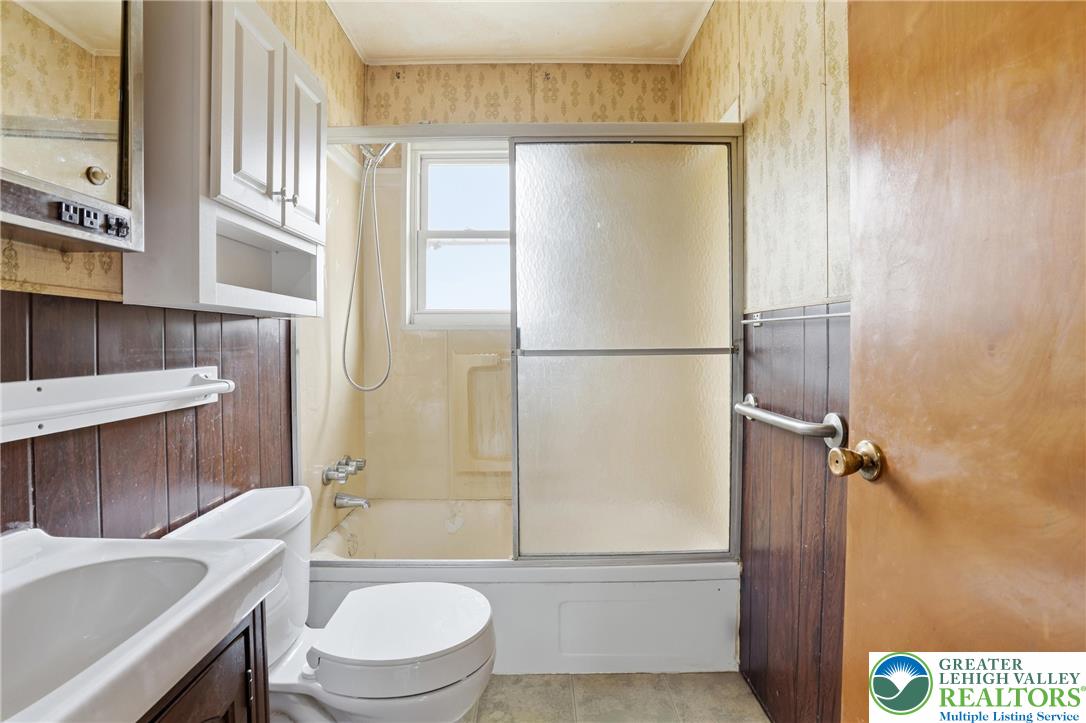 5478 2nd Street Whitehall, PA 18052 - Photo 21 of 30 a bathroom with a sink a toilet and a shower