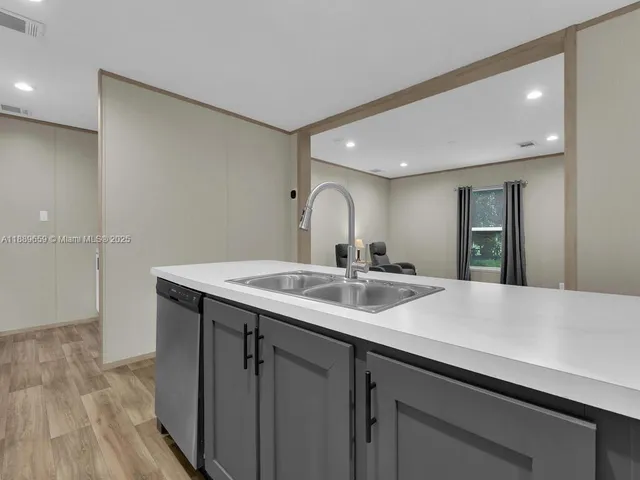 a en suite bathroom with a sink and mirror