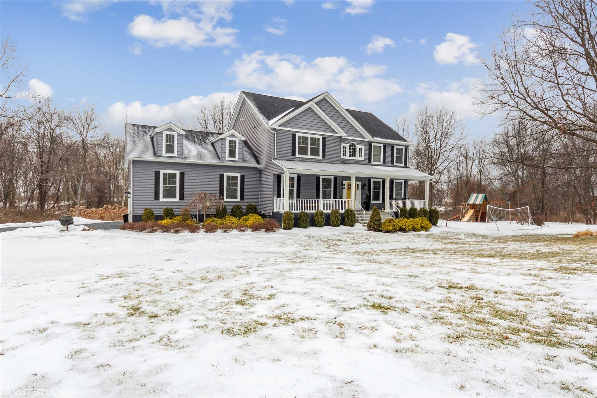 25 Riding Ridge Trail Beacon, NY 12508 - Photo 1 of 25 a view of a white house with a yard in the snow