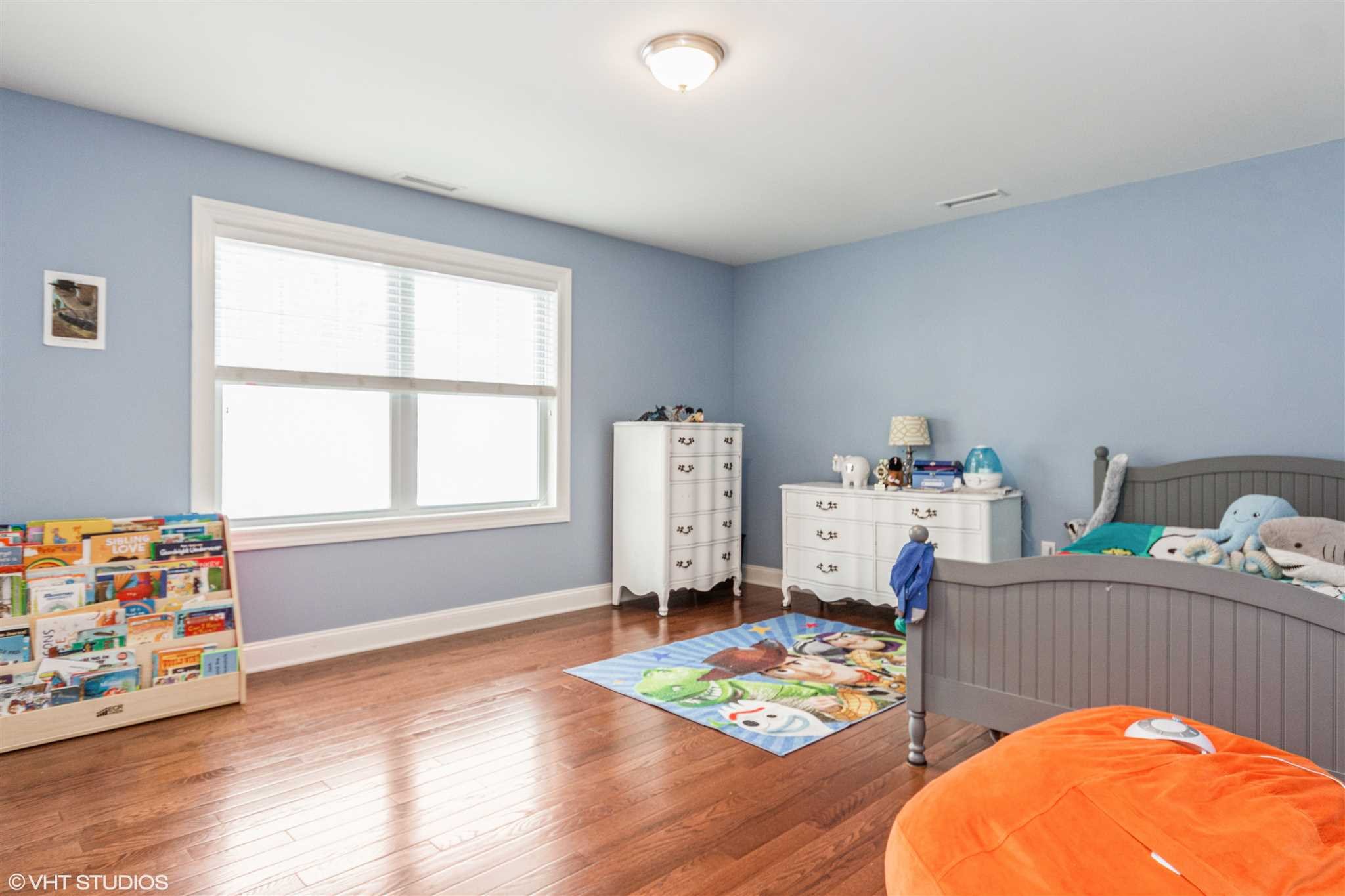 25 Riding Ridge Trail Beacon, NY 12508 - Photo 14 of 25 a bedroom with furniture and a wooden floor