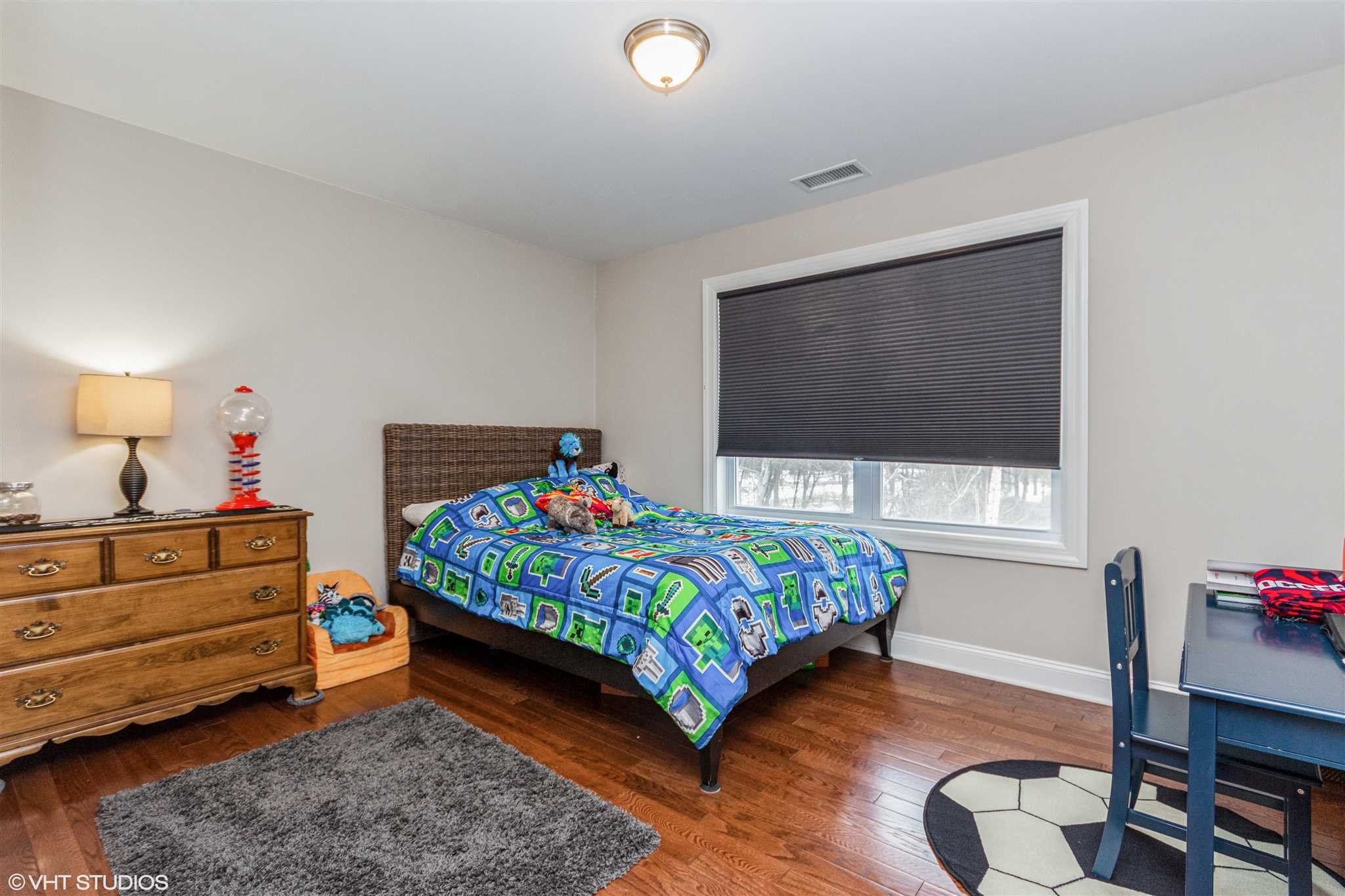 25 Riding Ridge Trail Beacon, NY 12508 - Photo 15 of 25 a bedroom with a bed and a dresser in it