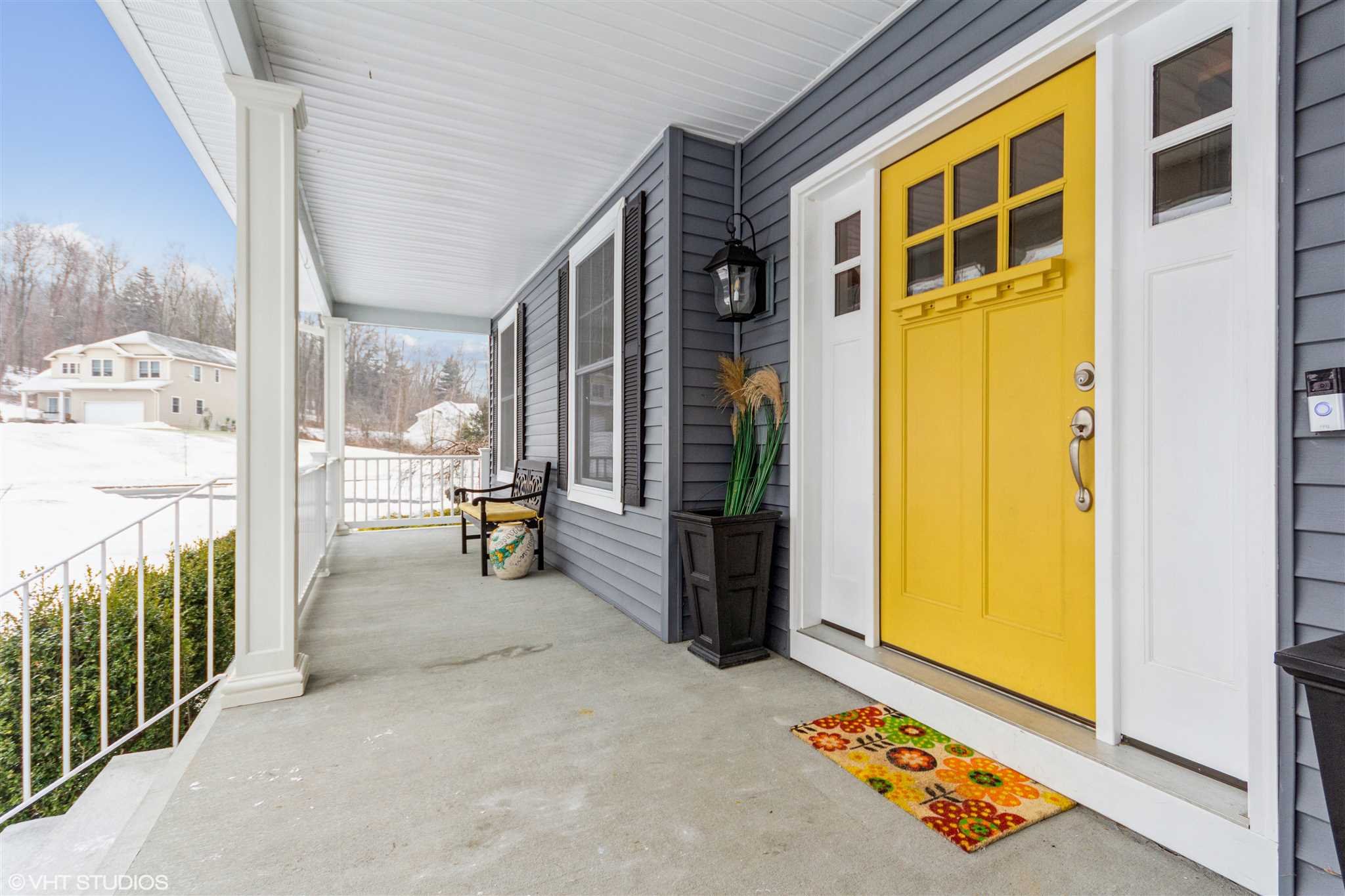 25 Riding Ridge Trail Beacon, NY 12508 - Photo 20 of 25 a view of a porch with a table and chairs
